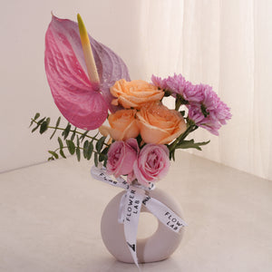 Vibrant Blooms in baby donut vase